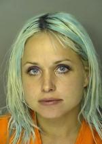 Arrested for failure to return a license plate after loss of insurance.
